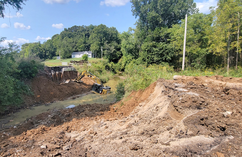Mercer County Bridge Demolition-excavator in creek